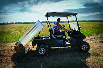 Hauler 1200X Side View in Field Dumping Hay.jpg